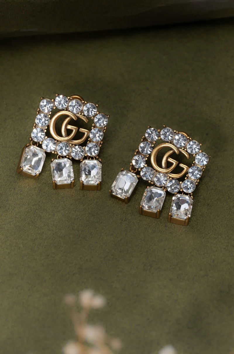 Clous d'oreilles Symbolic Lustre